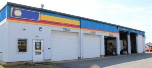 Commercial Garage Doors A set of commercial overhead doors installed at an auto shop.