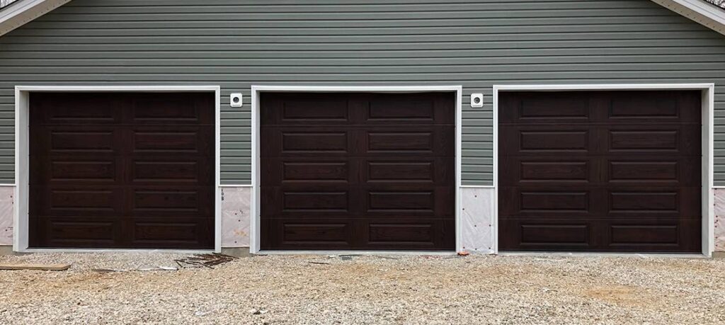 Three mahogany long-panel garage doors